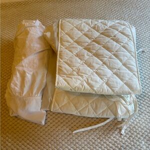 White Cotton crib bumper with white ruffled bedskirt